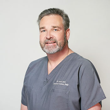 Dr. Stephan Kohnen wearing scrubs at Implant & Periodontic Specialists